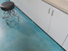 Blue stained and sealed concrete in a Las Vegas commercial space.