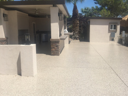 Image of a concrete driveway with an epoxy floor coating chip system.