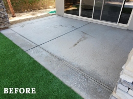 Image of a discolored and worn concrete patio before it's stained and resealed.