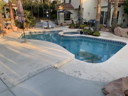 Before image of a chipped concrete pool deck in Las Vegas.