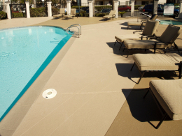 Stamped concrete pool deck with an accent color in a Las Vegas community.