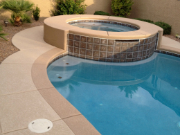 Closeup of concrete texturing with a highlight and border color on a Las Vegas pool deck and spa.