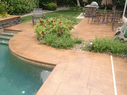 Stamped concrete with a random stone pattern on a Las Vegas pool deck and patio.